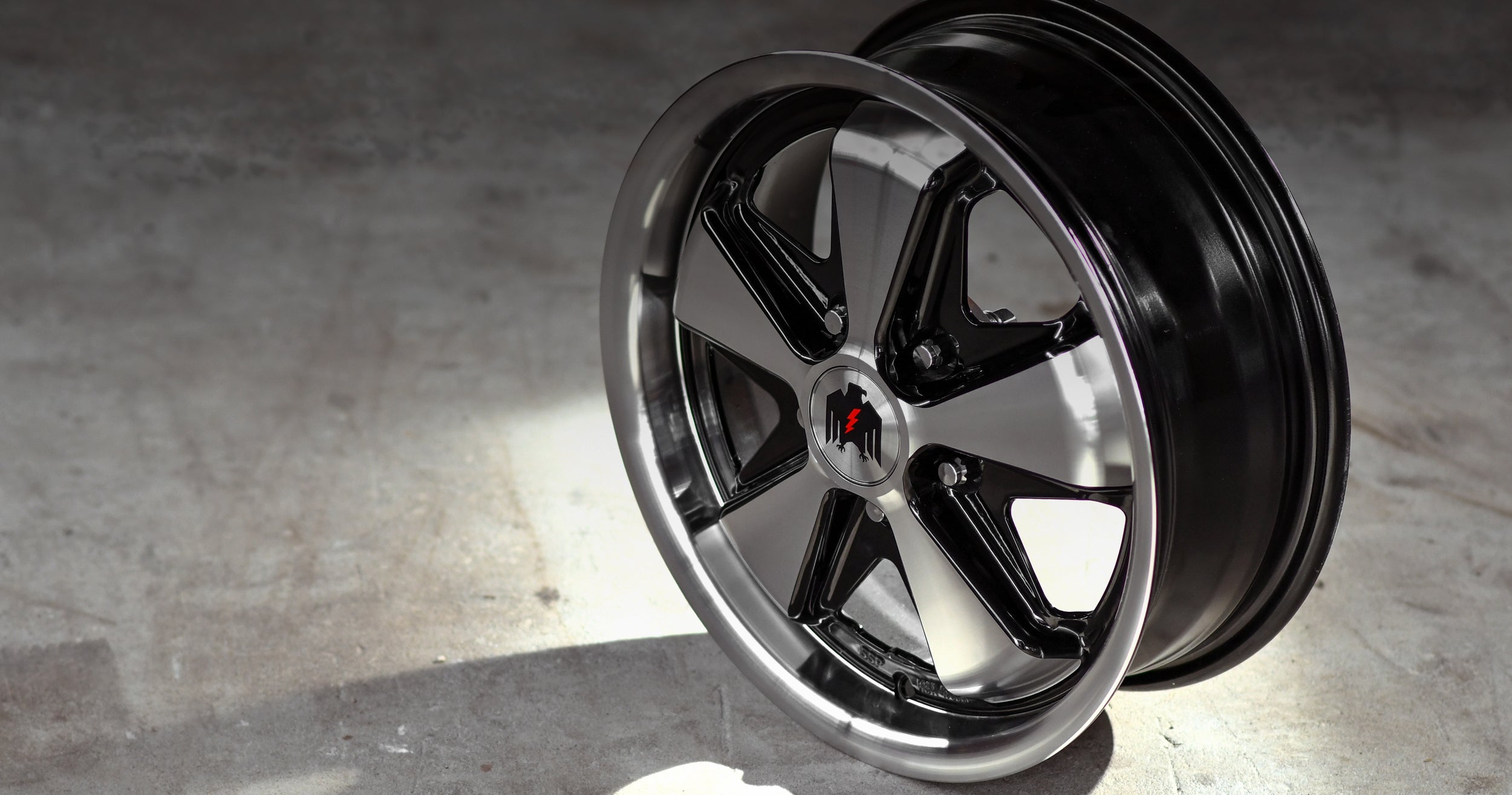 Klassik Rader Wheels 911 Gloss Black Machined Face & Lip on smooth concrete