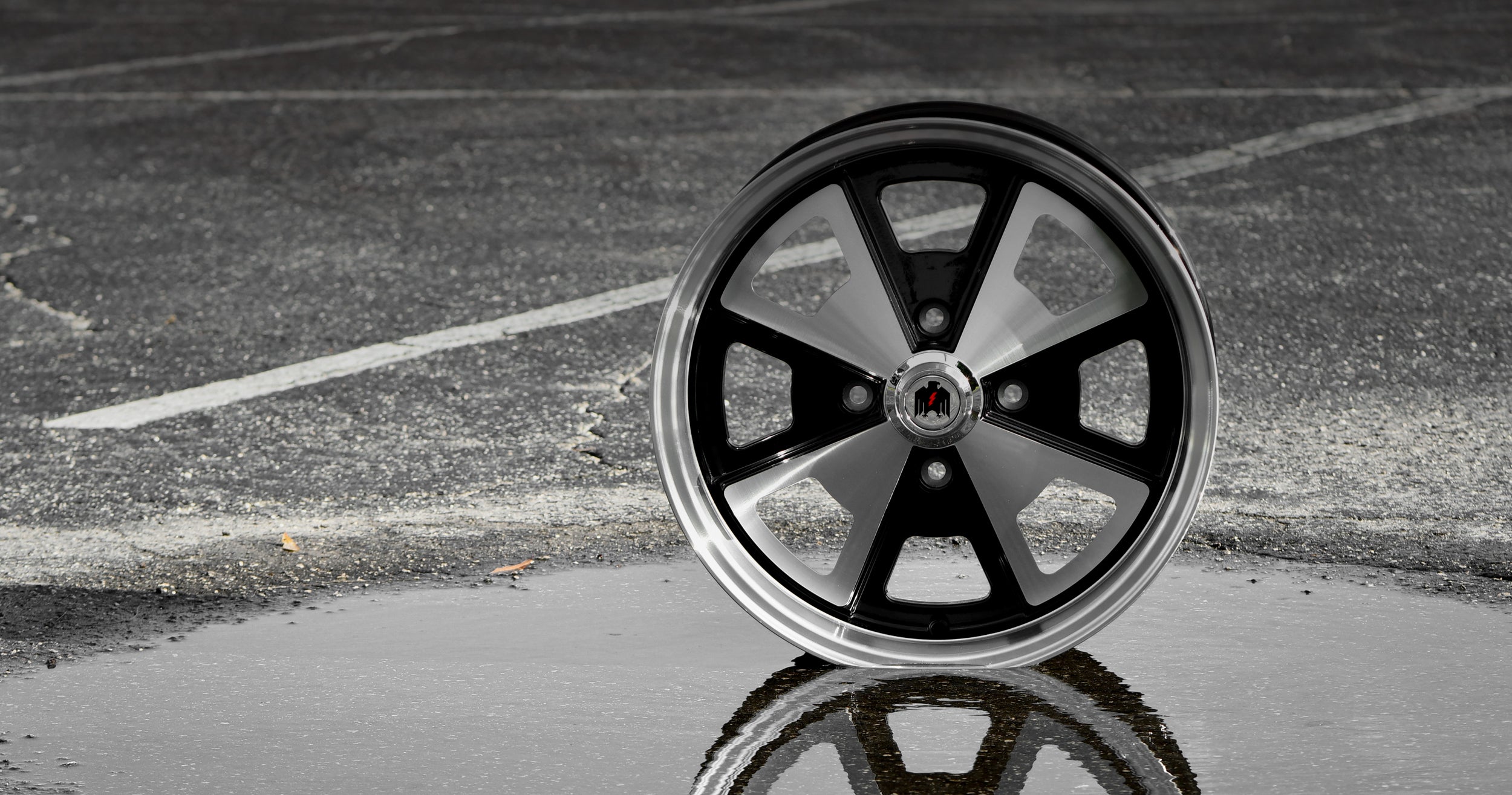 Klassik Rader Wheels 914 Gloss Black Machined Face & Lip on puddle with concrete